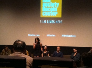 Desiree Akhavan standing as she fields audience questions.